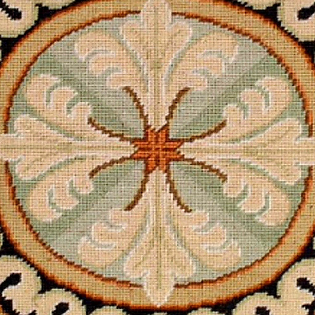 Closeup of Neogothic Red Medallion needlepoint throw pillow highlighting hand-stitched wool craftsmanship and fabric detail