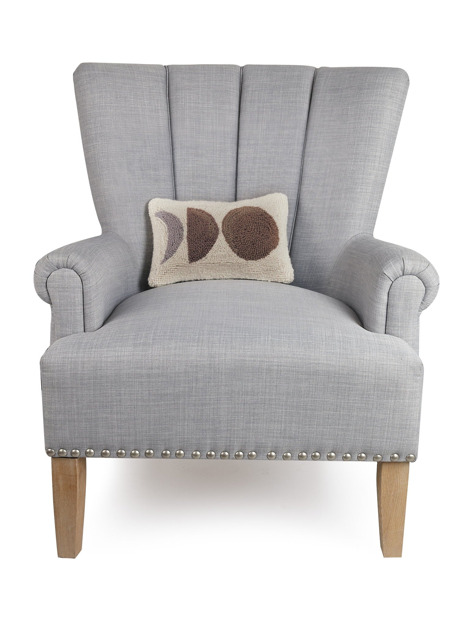Neutral Moons Hooked Wool Throw Pillow on an armchair, showing the throw pillow at room scale, 8x12 inch