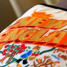 New England Charm Embroidered Travel Throw Pillow - close-up detail of hand-embroidered needlepoint stitching
