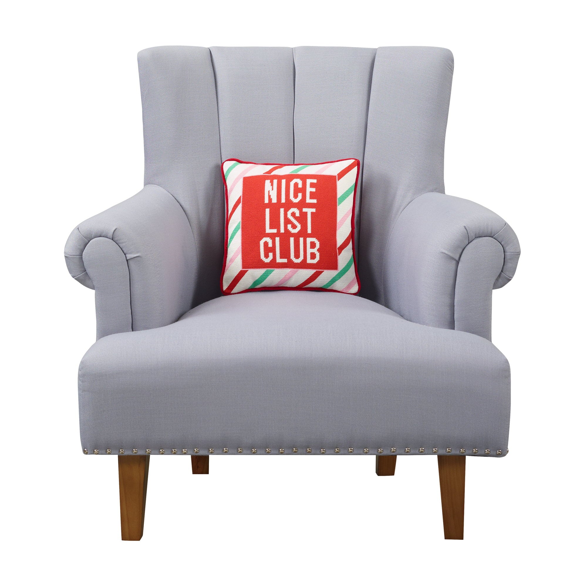 Nice List Club Embroidered Needlepoint Christmas Throw Pillow on an armchair, showing the throw pillow at room scale, 12x12 inch
