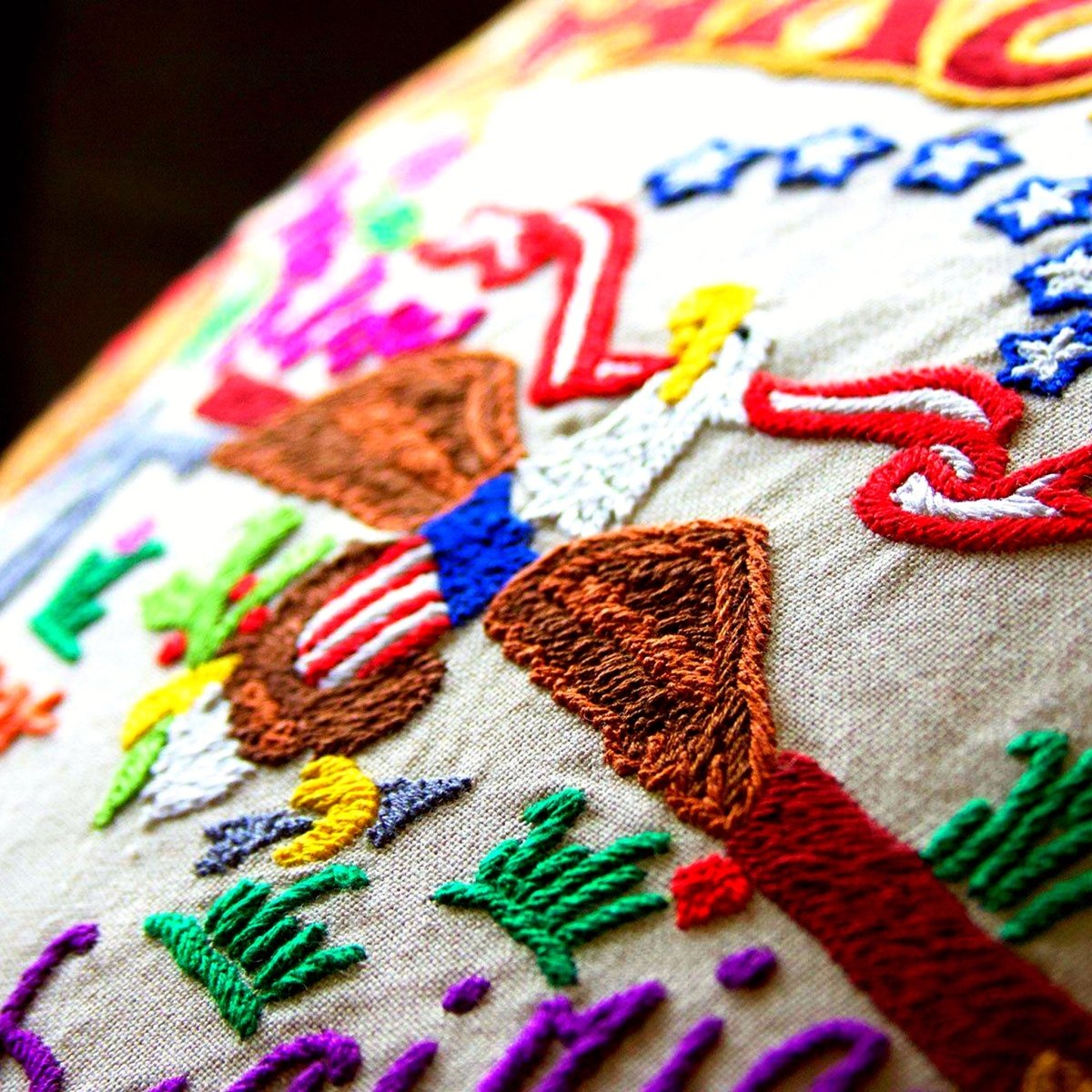 North Dakota State Flickertail Travel Embroidered Pillow - close-up detail of hand-embroidered needlepoint stitching