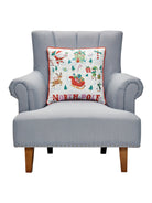 North Pole Printed Christmas Throw Pillow on an armchair, showing the throw pillow at room scale, 18x18 inch
