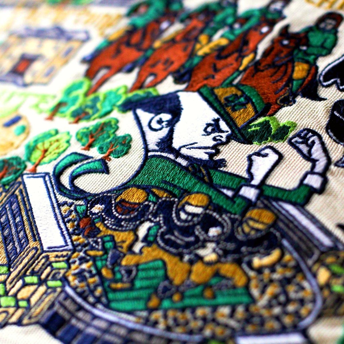 Notre Dame Fighting Irish Embroidered College Pillow - close-up detail of hand-embroidered needlepoint stitching