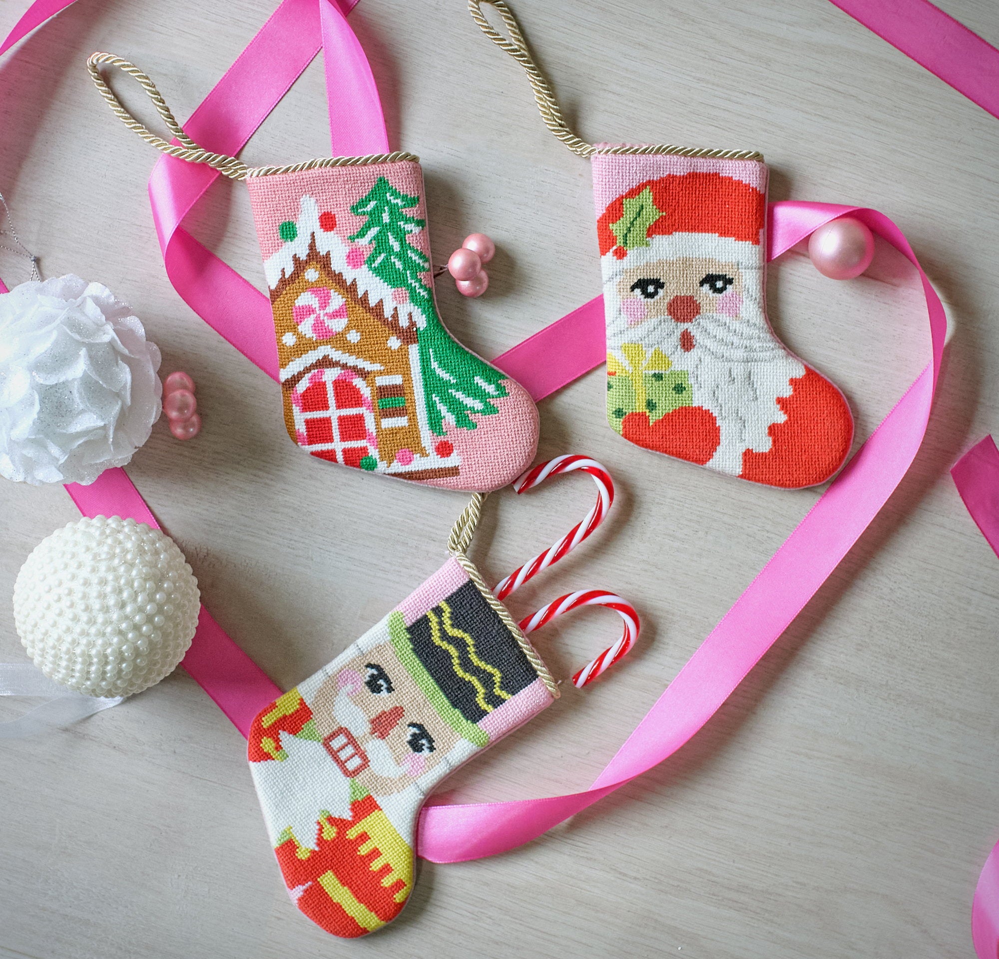 Nutcracker Portrait Mini Embroidered Needlepoint Christmas Stocking, 6x4 inch, four mini stockings on pink ribbon with white ornaments