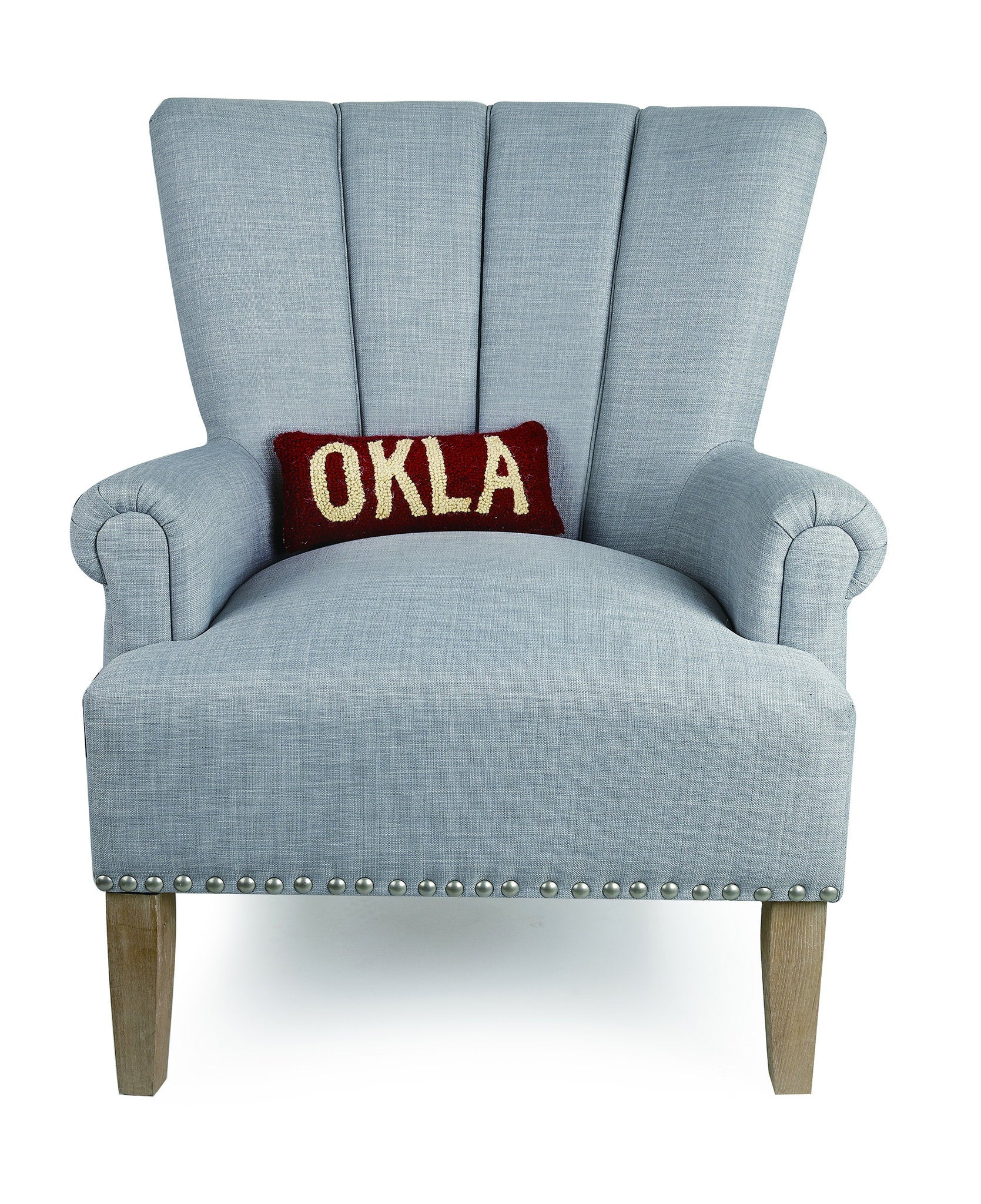 Oklahoma Red/White Hooked Wool Throw Pillow on an armchair, showing the throw pillow at room scale, 12x5 inch