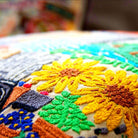 Omaha, NE Gateway City Embroidered Travel Throw Pillow - close-up detail of hand-embroidered needlepoint stitching