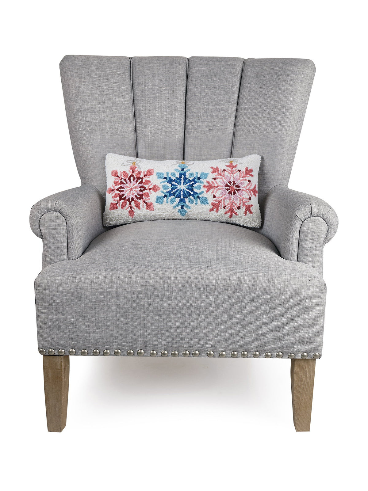 Ornaments Hooked Wool Christmas Throw Pillow on an armchair, showing the throw pillow at room scale, 9x18 inch