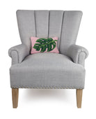 Palm Leaf Hooked Wool Throw Pillow on an armchair, showing the throw pillow at room scale, 8x12 inch