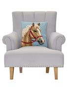 Palomino Horse Hooked Wool Throw Pillow on an armchair, showing the throw pillow at room scale, 16x16 inch