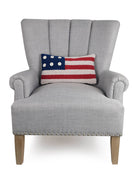 Patriotic Flag Hooked Wool Throw Pillow on an armchair, showing the throw pillow at room scale, 9x16 inch