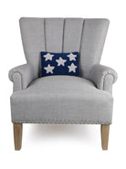 Patriotic Stars Hooked Wool Throw Pillow on an armchair, showing the throw pillow at room scale, 8x12 inch