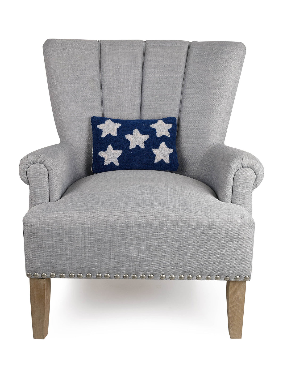Patriotic Stars Hooked Wool Throw Pillow on an armchair, showing the throw pillow at room scale, 8x12 inch