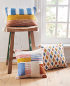 Percy Decorative Hooked Throw Pillow, 12x18 inch, two pillows, one on a wooden stool by a window