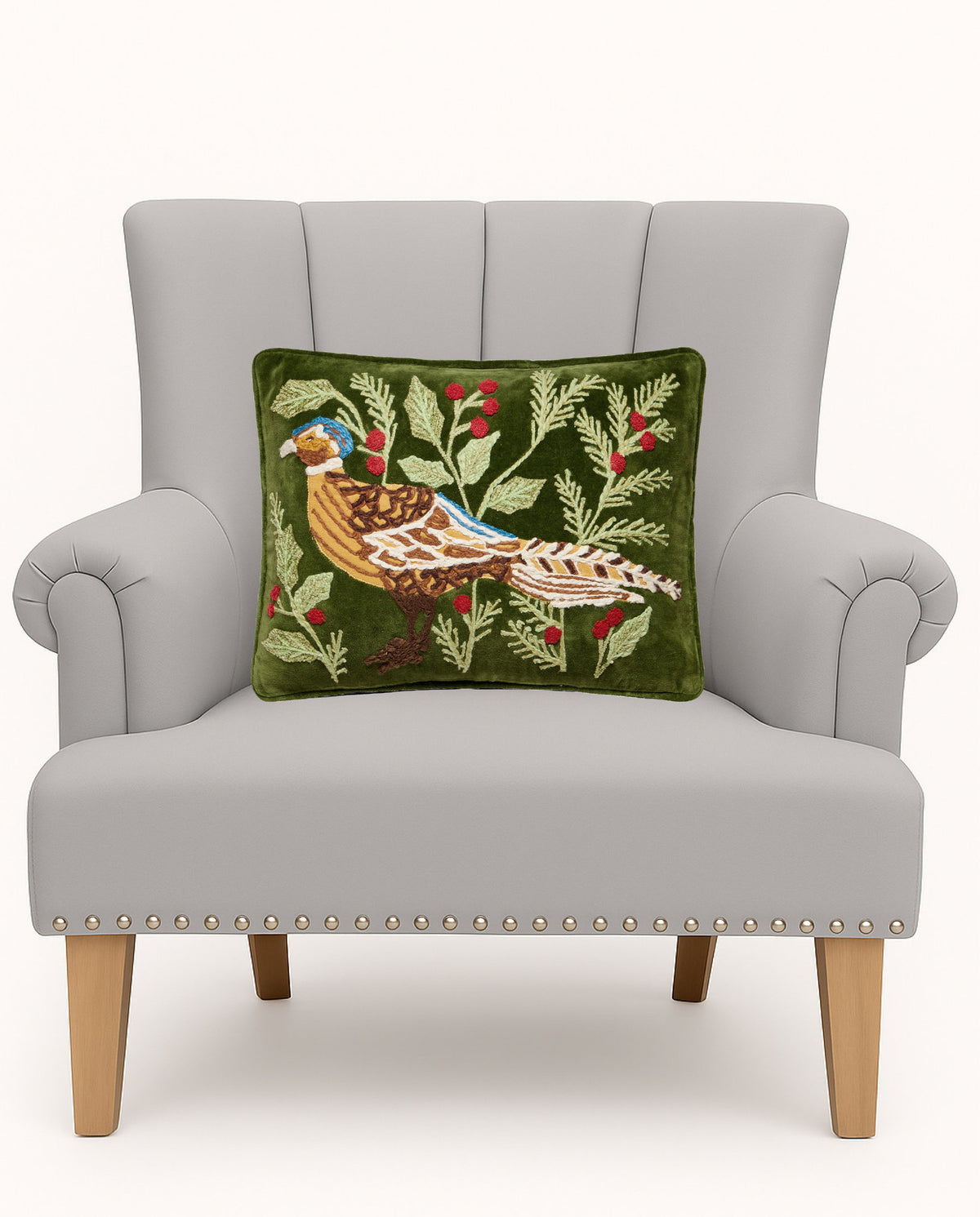 Pheasant Embroidered Christmas Throw Pillow on an armchair, showing the throw pillow at room scale, 12x16 inch