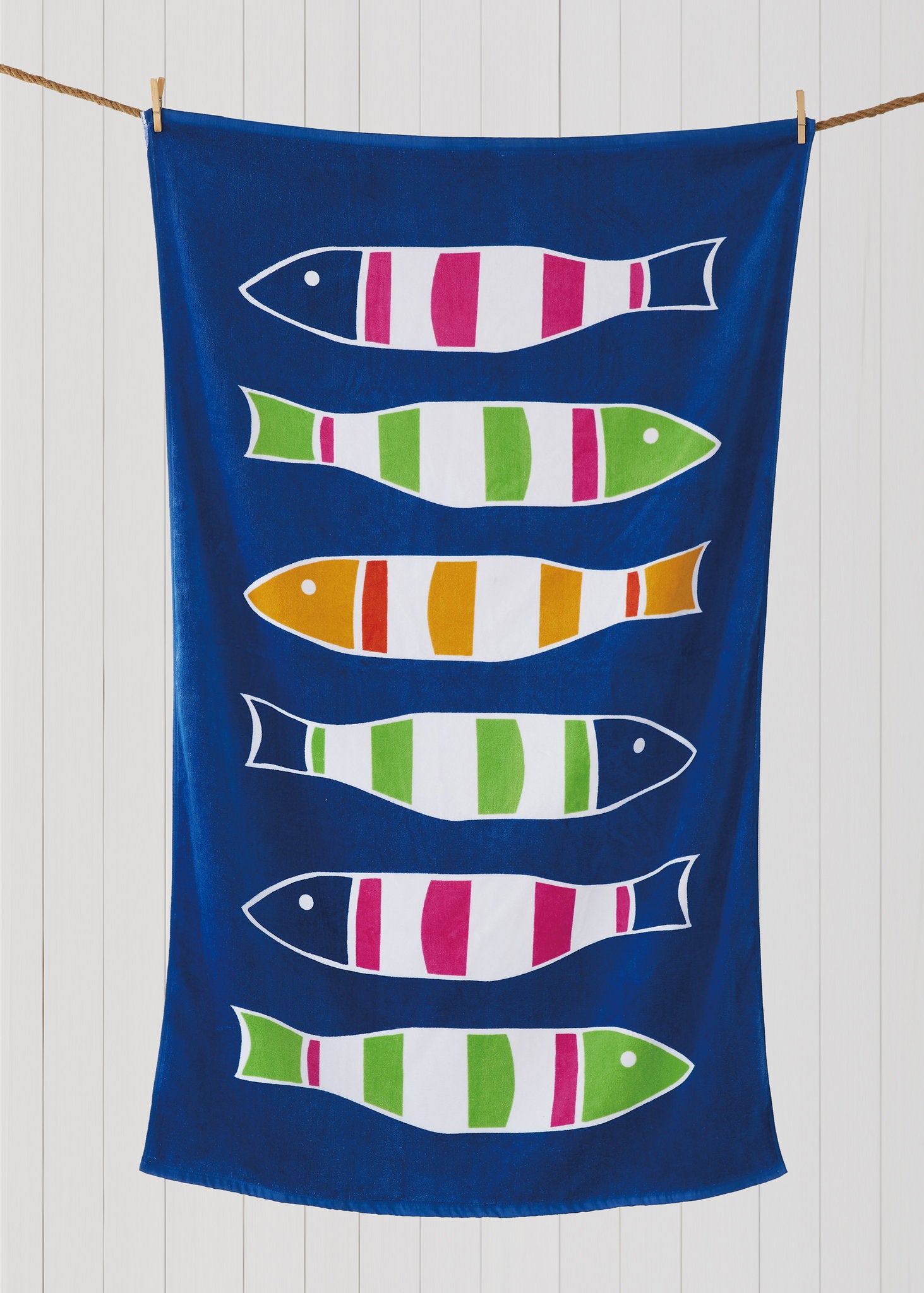 Picket Fish Beach Towel styled in a room setting, 35x60 inch