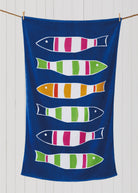 Picket Fish Beach Towel styled in a room setting, 35x60 inch