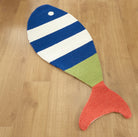 Picket Fish Shaped Hooked Wool Rug styled in a room setting, 20x50 inch