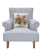 Pine Cluster Embroidered Christmas Throw Pillow on an armchair, showing the throw pillow at room scale, 16x16 inch