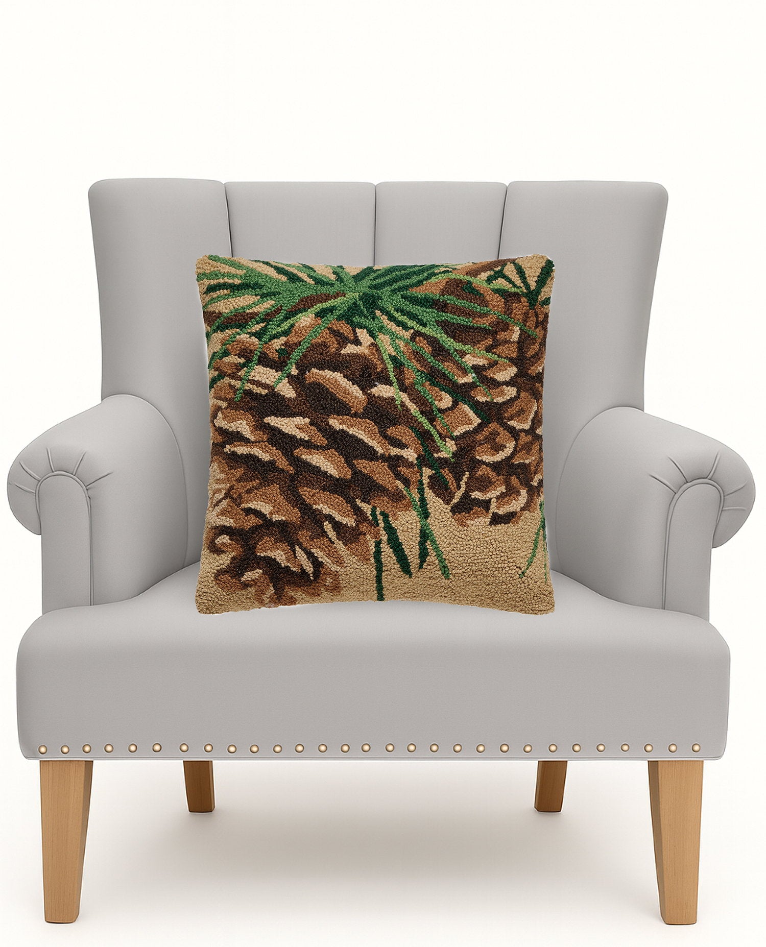 Pine Hooked Wool Throw Pillow on an armchair, showing the throw pillow at room scale, 18x18 inch