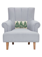 Pine Trees Trio Hooked Wool Christmas Throw Pillow on an armchair, showing the throw pillow at room scale, 8x12 inch