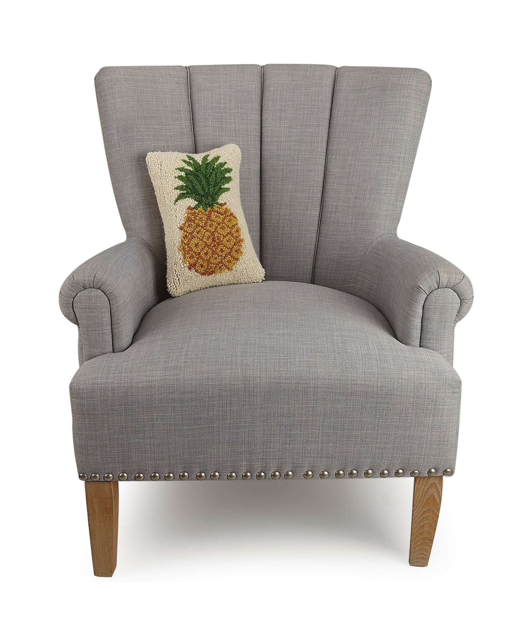 Pineapple Hooked Wool Throw Pillow on an armchair, showing the throw pillow at room scale, 8x12 inch
