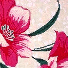 Hand-stitched wool detail of Pink Hibiscus needlepoint pillow showing intricate weave pattern and texture