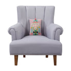 Pink Nutcracker Hooked Wool Christmas Throw Pillow on an armchair, showing the throw pillow at room scale, 8x12 inch