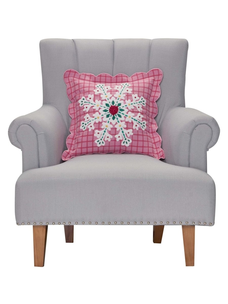 Pink Plaid Snowflake Embroidered Christmas Throw Pillow on an armchair, showing the throw pillow at room scale, 16x16 inch