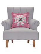 Pink Plaid Snowflake Embroidered Christmas Throw Pillow on an armchair, showing the throw pillow at room scale, 16x16 inch