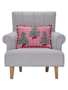 Pink Plaid Trees with Poms Embroidered Christmas Throw Pillow on an armchair, showing the throw pillow at room scale, 14x20 inch