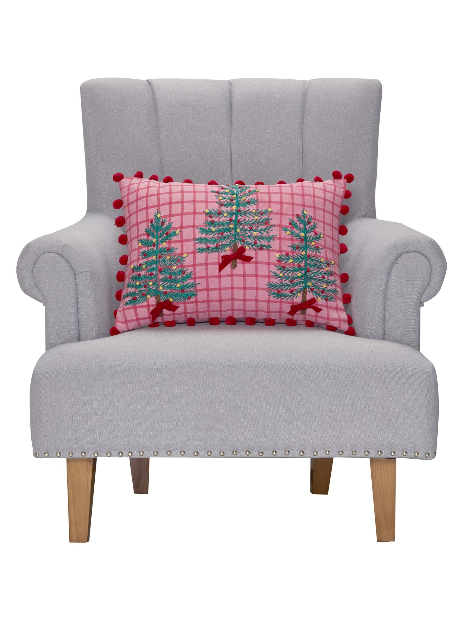 Pink Plaid Trees with Poms Embroidered Christmas Throw Pillow on an armchair, showing the throw pillow at room scale, 14x20 inch