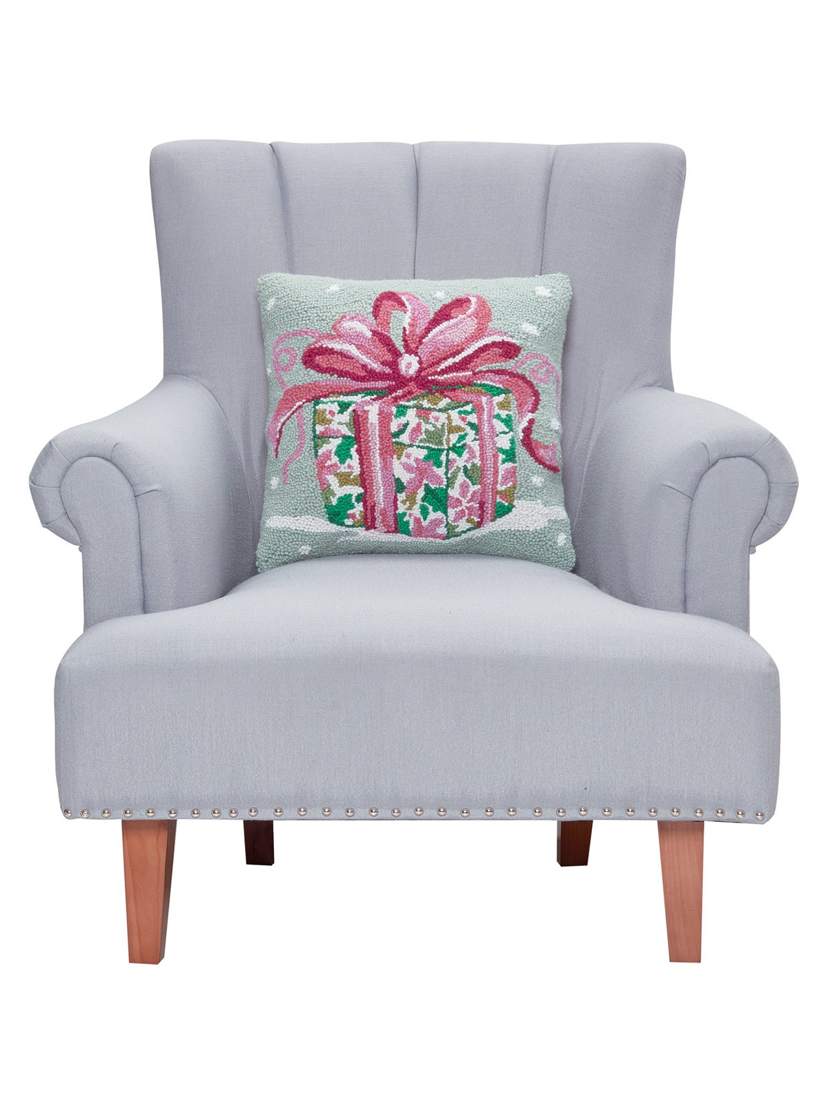 Pink Present Hooked Wool Christmas Throw Pillow on an armchair, showing the throw pillow at room scale, 16x16 inch