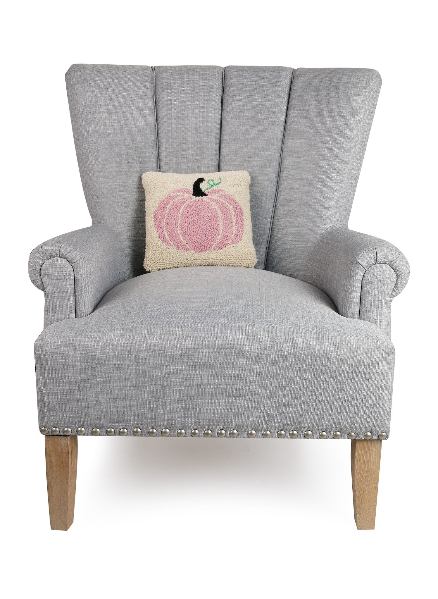 Pink Pumpkin Hooked Wool Fall Harvest Throw Pillow on an armchair, showing the throw pillow at room scale, 10x10 inch