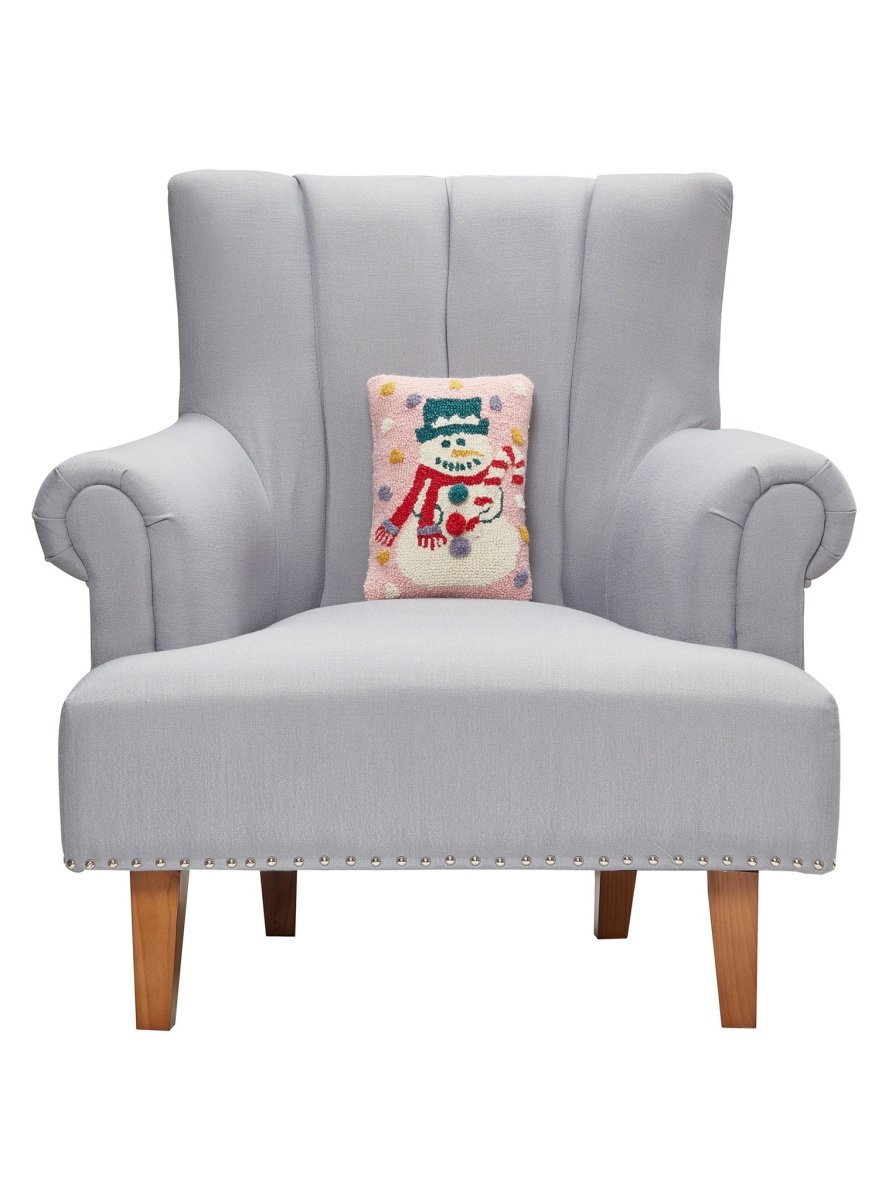 Pink Snowman Hooked Wool Christmas Throw Pillow 8x12 on an armchair, showing the throw pillow at room scale, 8x12 inch
