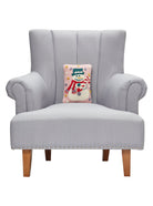 Pink Snowman Hooked Wool Christmas Throw Pillow 8x12 on an armchair, showing the throw pillow at room scale, 8x12 inch