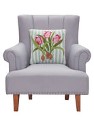 Pink Tulip Hooked Wool Throw Pillow on an armchair, showing the throw pillow at room scale, 16x16 inch