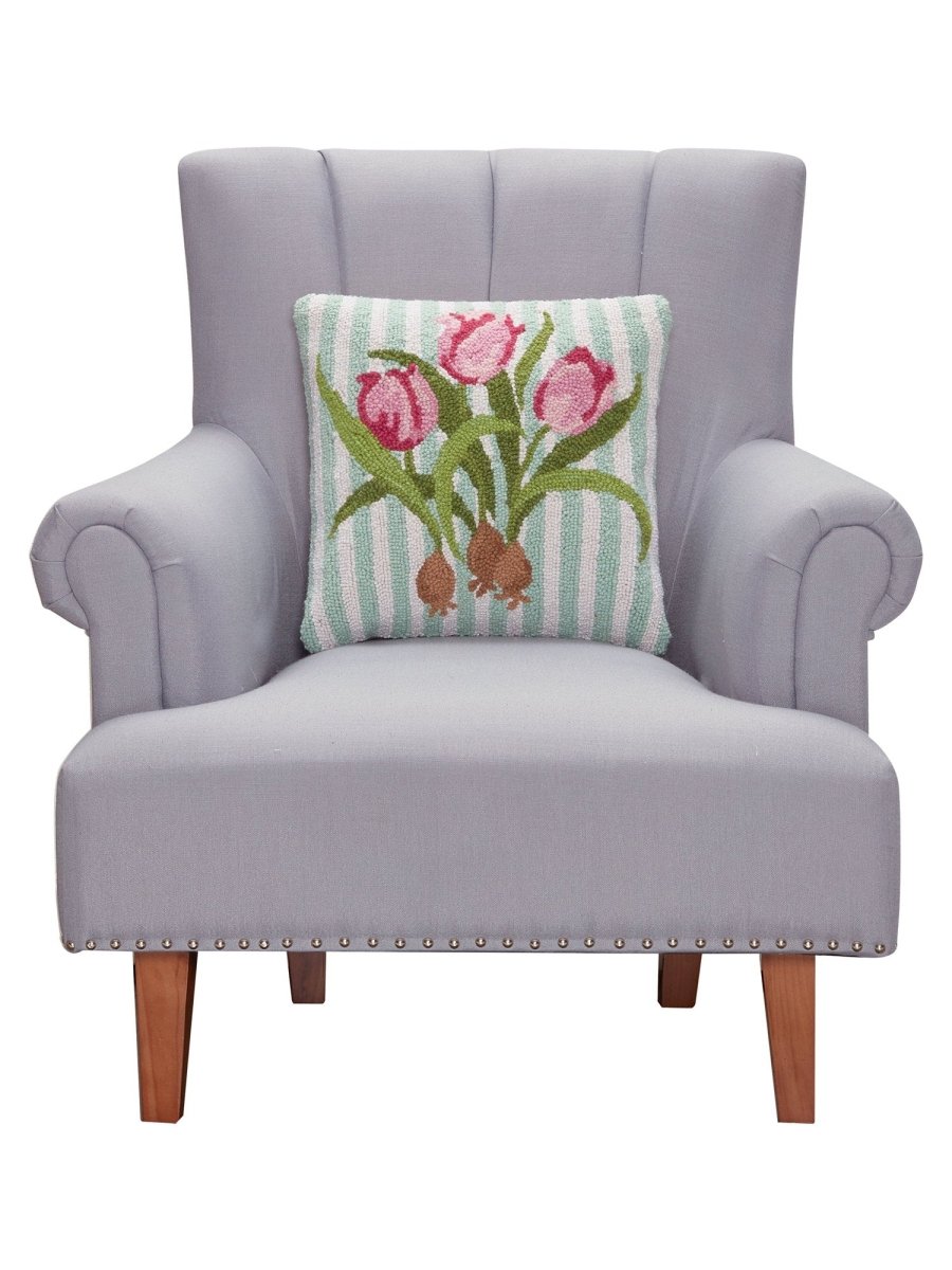 Pink Tulip Hooked Wool Throw Pillow on an armchair, showing the throw pillow at room scale, 16x16 inch