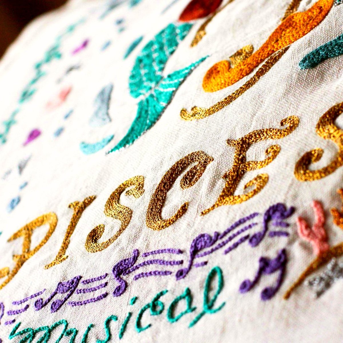 Pisces Astrology Zodiac Embroidered Throw Pillow - close-up detail of hand-embroidered needlepoint stitching
