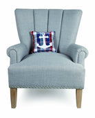 Plaid Anchor Embroidered Throw Pillow on an armchair, showing the throw pillow at room scale, 10x10 inch