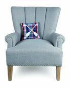 Plaid Oars Embroidered Throw Pillow on an armchair, showing the throw pillow at room scale, 10x10 inch