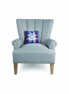Plaid Wheel Embroidered Throw Pillow on an armchair, showing the throw pillow at room scale, 10x10 inch