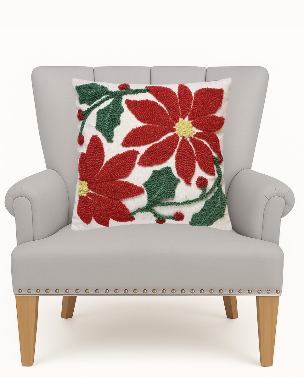 Poinsettia Tufted Hooked Wool Christmas Throw Pillow on an armchair, showing the throw pillow at room scale, 16x16 inch