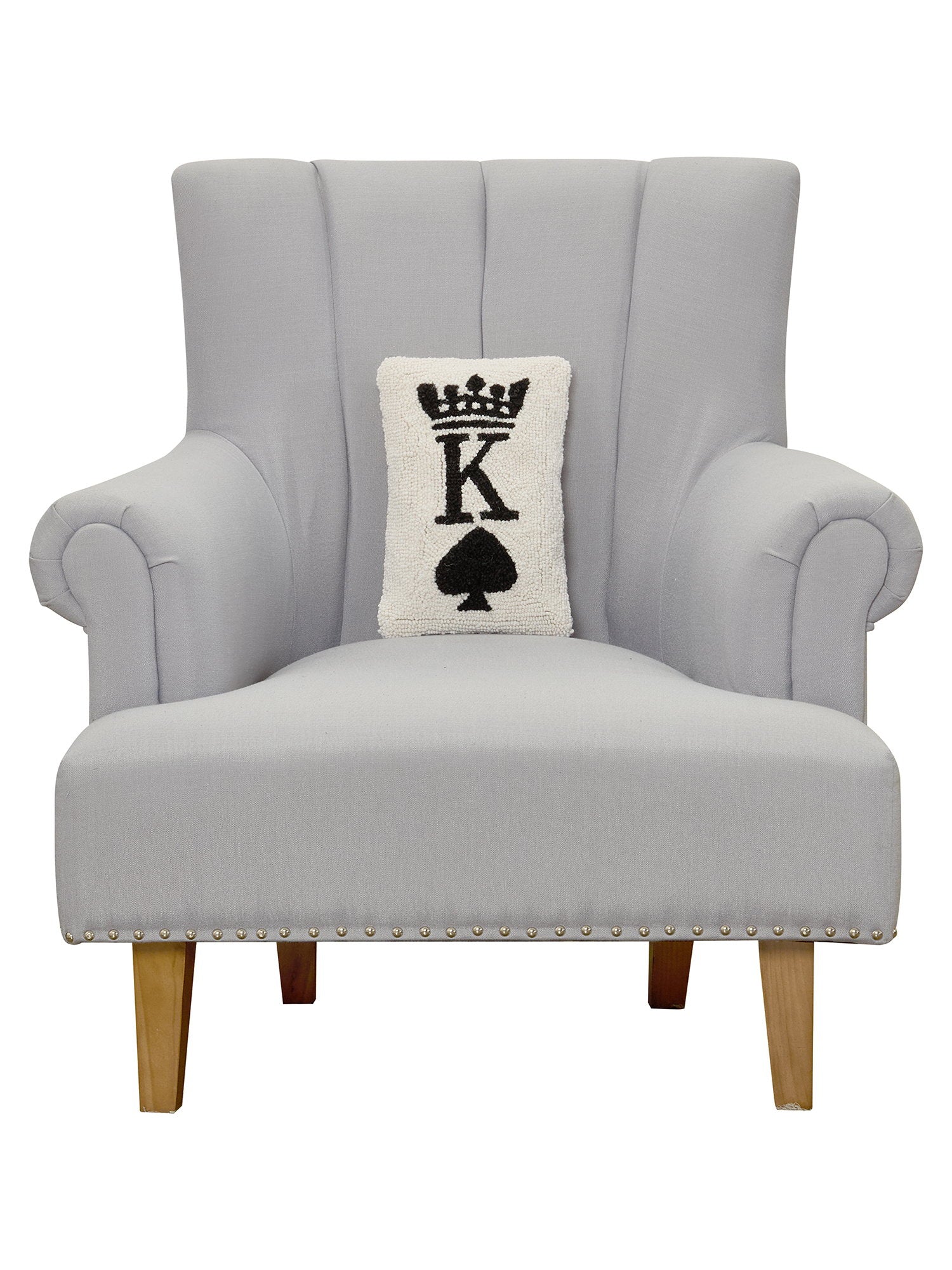 Poker King Hooked Wool Throw Pillow on an armchair, showing the throw pillow at room scale, 8x12 inch