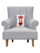 Poker Queen Hooked Wool Throw Pillow on an armchair, showing the throw pillow at room scale, 8x12 inch