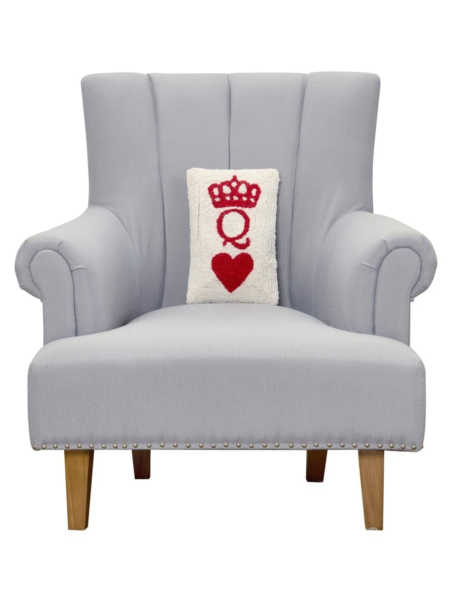 Poker Queen Hooked Wool Throw Pillow on an armchair, showing the throw pillow at room scale, 8x12 inch