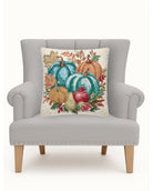 Pomegranate Teal Harvest Hooked Wool Fall Harvest Throw Pillow on an armchair, showing the throw pillow at room scale, 18x18 inch