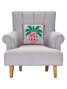 Preppy Pineapple Hooked Wool Throw Pillow on an armchair, showing the throw pillow at room scale, 14x14 inch