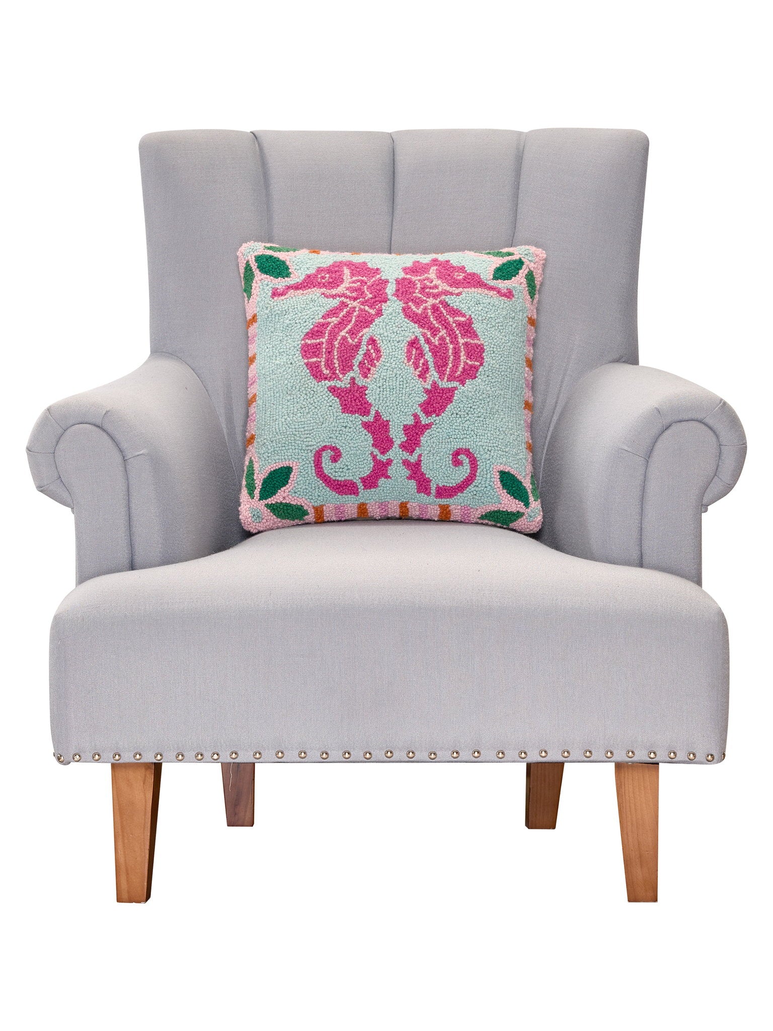 Preppy Seahorse Hooked Wool Throw Pillow on an armchair, showing the throw pillow at room scale, 16x16 inch