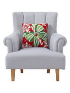 Pretty Present Hooked Wool Christmas Throw Pillow on an armchair, showing the throw pillow at room scale, 16x16 inch