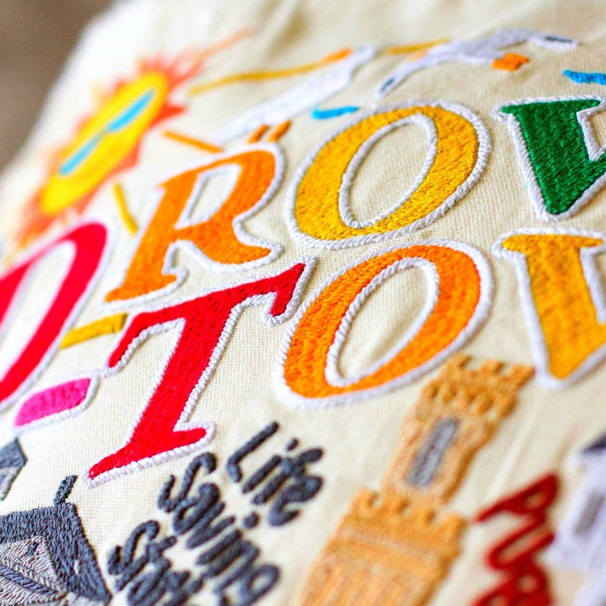 Provincetown, MA Pilgrim City Embroidered Travel Pillow - close-up detail of hand-embroidered needlepoint stitching